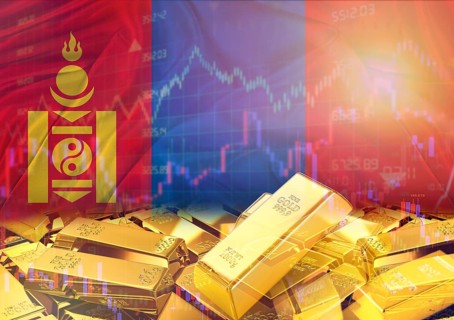 Gold bars on Mongolia flag in background. Gold bars stacked on Mongolian flag. Concept of Mongolia