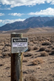 Round Mountain, Nevada - A sign warns of a buried fiber optic cable in the Nevada desert