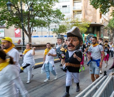 Evening procession through city streets by youth group organisation, Pilar 2025 festival event,