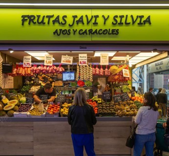 Market stall shop store selling fruit and vegetables inside Mercado Central de Zaragoza, Zaragoza,