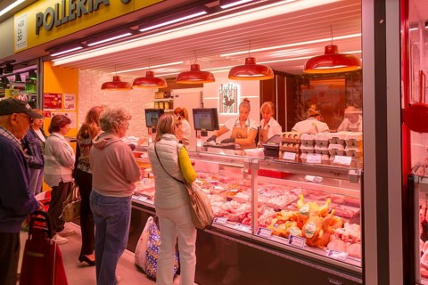 Market stall shop store selling chicken meat products inside Mercado Central de Zaragoza, Zaragoza,