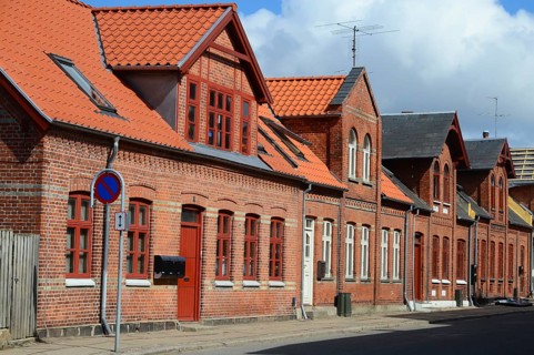 Row of brick houses along a street in Assens, Funen island, Denmark, Scandinavia
