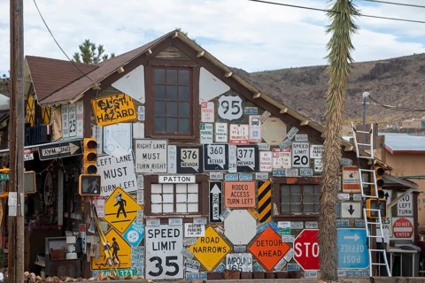Goldfield, Nevada - An old house covered by road signs