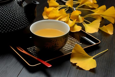 Ginkgo tea in tea bowl and ginkgo leaf, ginkgo biloba