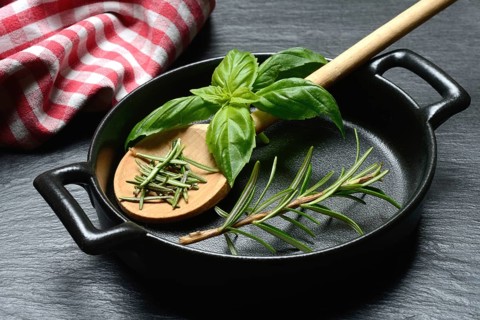 Rosemary, rosemary leaves and rosemary sprig with cooking pot