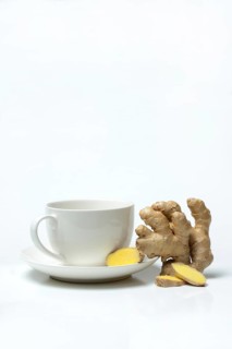 Ginger root with cup, ginger tea