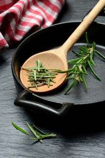 Rosemary, rosemary leaves and rosemary sprig with cooking pot