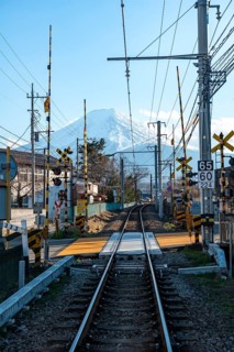 Rails of a railway line, behind Vulkan Mt. Fuji, Fujiyoshida, Yamanashi Prefecture, Japan