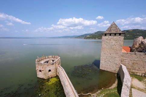 Golubac Fortress or Kolumbatz or Pigeon Town or Pigeon Castle on the Danube, in the background the