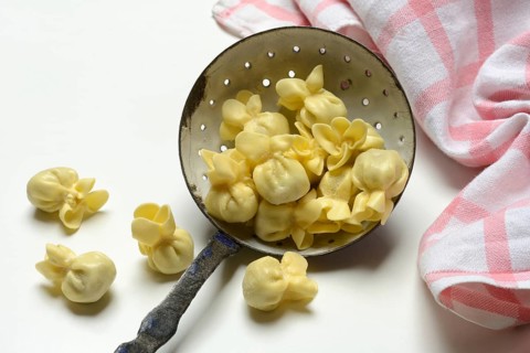 Saccottini, type of Italian pasta in a sieve ladle, pasta from Italy