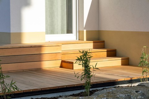 Beautiful wooden terrace on a newly landscaped garden