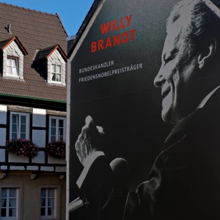 Huge poster with Willy Brandt portrait on a fire wall of the Willy Brandt Forum next to a