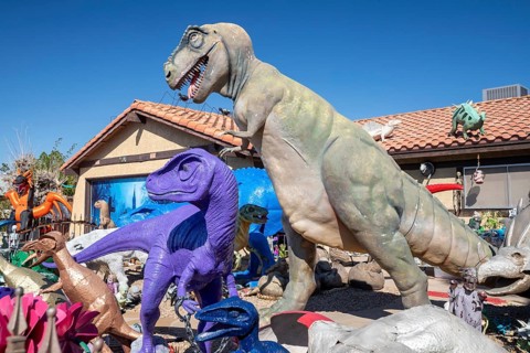 Henderson, Nevada - Dinosaurs dominate the yard of a house in suburban Las Vegas, placed there by