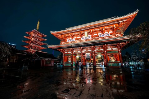Illuminated five-story pagoda and main hall of Asakusa Shrine or Senso-ji Temple, at night,