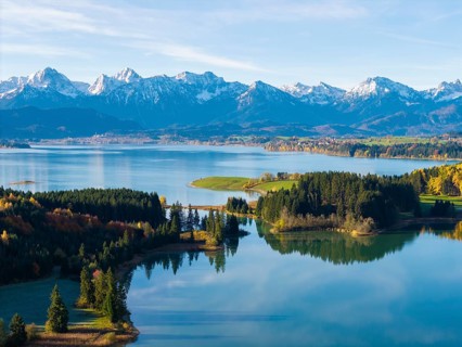 Natural scenery with snow-covered mountains, a lake and autumn leaves, Illasbergsee, Forggensee,