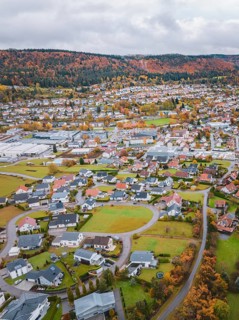 Residential area surrounded by vivid autumn colors on the surrounding hills, Wehingen, Tuttlingen