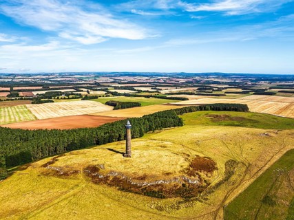 Waterloo Monument over Scottish fields and farms from a drone, Jedburgh, Scotland, UK