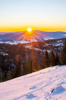 Sunrise over the hills of czech republic from Mount Lusen wth the view over the hills of the
