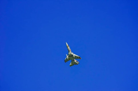A single-jet fighter jet during a flight demonstration as part of an air show at the Rossfeld Air