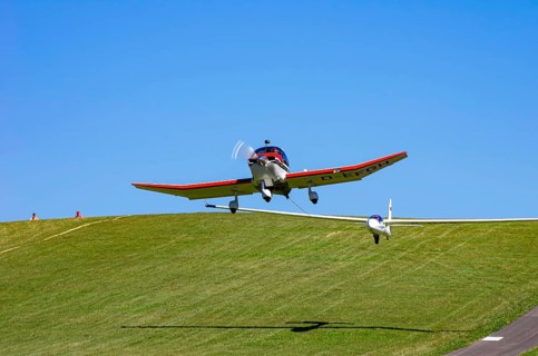 A Robin DR 400/200R Remorqueur light aircraft, registration D-EFGH, tows a glider during a flight