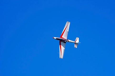 A single-engine aerobatic aircraft during a flight demonstration at the Rossfeld Luftsportverein in