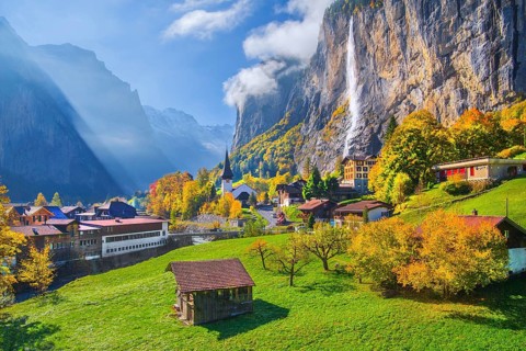 View of town and valley with Staubbach waterfall in autumn, Lauterbrunnen, Bernese Oberland, Canton