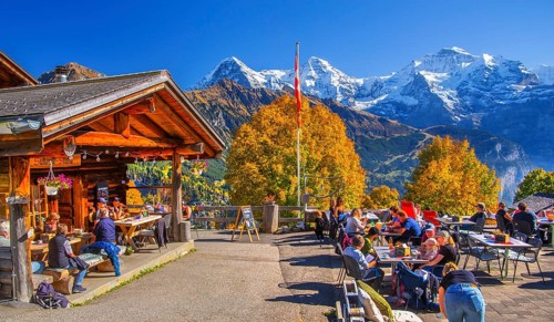 Sun terrace of the mountain inn in the hamlet of Sulwald with Eiger 3967m, Mönch 4110m and Jungfrau
