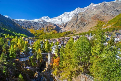 City overview with Allalin 4027 m, Alphubel 420 6 m and Mischabel group 4545 m in autumn, Saas-Fee,