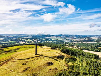 Waterloo Monument over Scottish fields and farms from a drone, Jedburgh, Scotland, UK