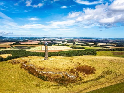 Waterloo Monument over Scottish fields and farms from a drone, Jedburgh, Scotland, UK