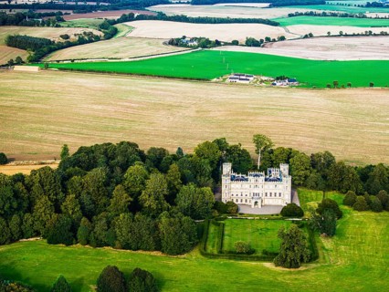 Wedderburn Castle and Barns over fields from a drone, Duns, Berwickshire, Scotland, UK