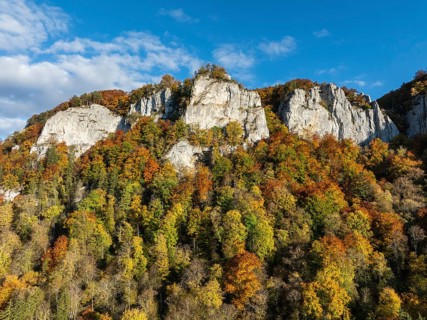 Aerial view of the Upper Danube Valley surrounded by autumn vegetation with the Hausender Peaks