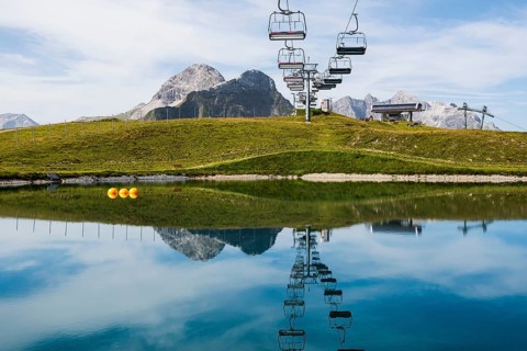 Mountain landscape with reservoir and chairlift, Saloberkopf, Warth, Bregenzerwald, Vorarlberg,