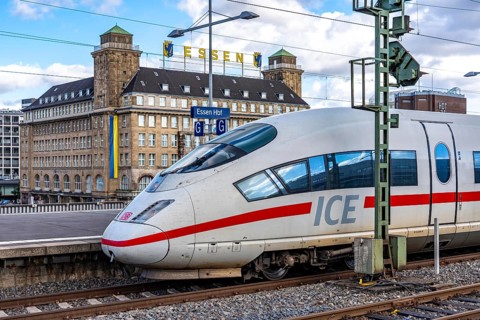 ICE train on track 2 in Essen main station, view of the city center, Handelshof building with Essen
