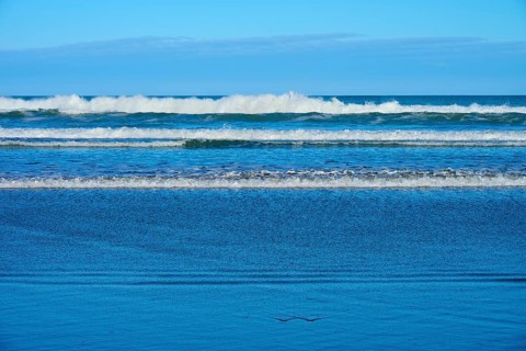 Gentle waves meet the beach, sky and sea in harmony, Spencer Park Beach, Spencerville,