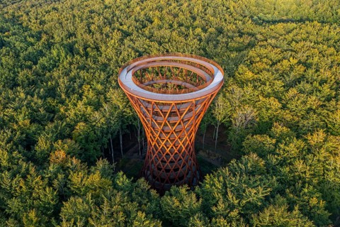 Aerial view over 45-meter-tall hyperboloid observation tower in forest near Gisselfeld monastery at
