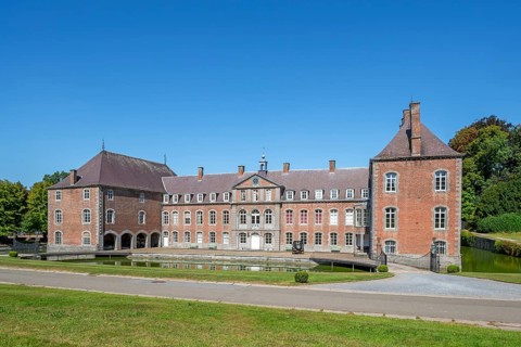 16th century Classicist Château de Franc-Waret in Louis XV style, moated castle in the village