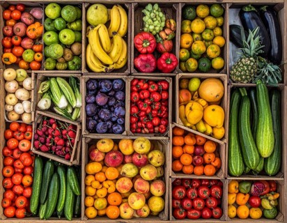 Fresh fruits and vegetables in a market display, aerial view perpendicular top down, healthy eating