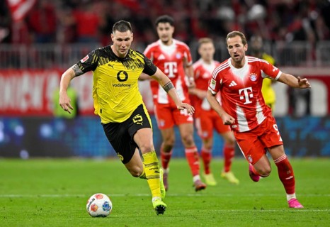 Niklas Süle Borussia Dortmund BVB (25) Ball action Harry Kane FC Bayern Munich FCB (09) German