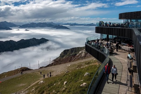 Restaurant at the Nebelhorn summit with views of the Allgäu Alps, mountains rising from fog in the