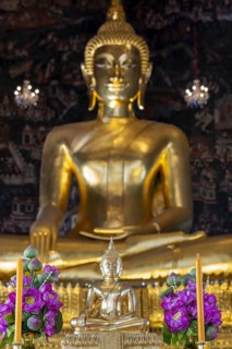 Golden Buddha statue, Phra Buddha Trilokachet surrounded by exquisite wall paintings, interior view