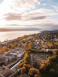 Aerial view of a lakeside town in autumn weather with beautiful clouds and buildings, Überlingen,