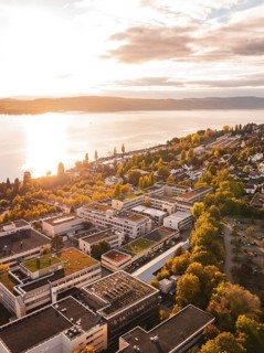Sunlight floods an urban landscape with views of the lake and surrounding buildings, Überlingen,