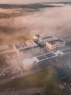 Industrial complex and natural environment shrouded in thick fog, new hospital health campus