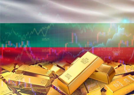 Gold bars on Bulgaria flag in background. Gold bars stacked on Bulgarian flag. Concept of Bulgaria