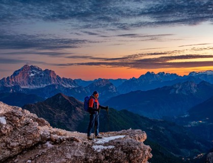 Mountaineers in front of rugged Dolomite peaks in the evening light, Dolomites, Alps, Belluno