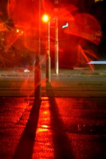 Traffic light, road traffic at night and poor visibility in a city, autumn, Germany