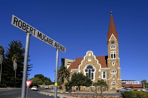 Robert Mugabe Avenue sign in front of the 1910 Evangelical Lutheran Christ Church, Windhoek, Khomas