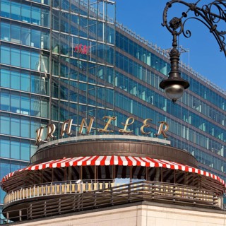Café Kranzler with historic lantern and modern office building on Kurfürstendamm, Charlottenburg,