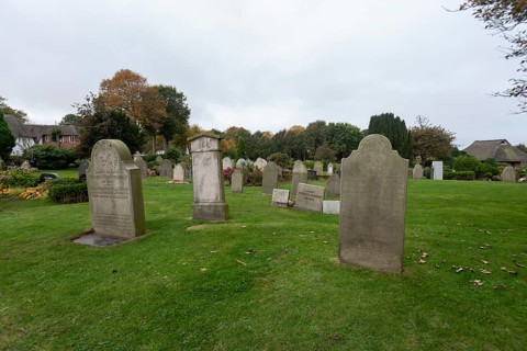 Cemetery of St John's Church with gravestones telling the story of seafarers, known as talking